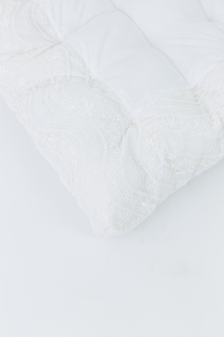 All white cotton fabric with white lace edges.