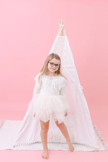 This tent is all white and it is made of 100% pima cotton fabric. The top triangle of the tent has a stunning embroidered white lace.