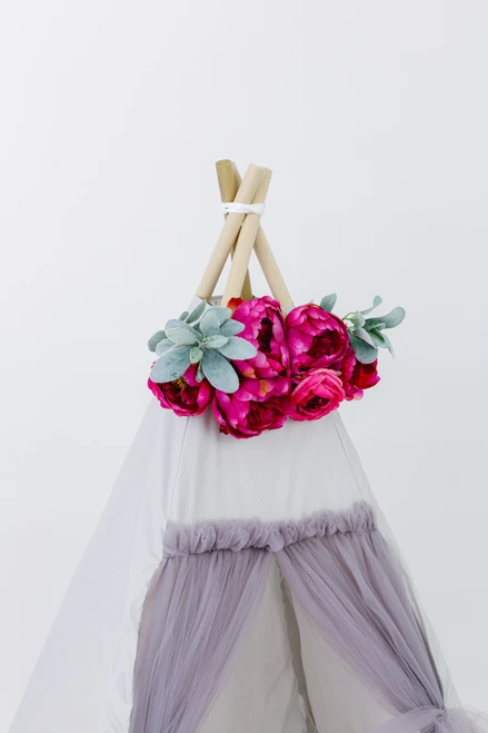 Tulle is four layers thick of gray tulle. The rest of the tent is a light gray fabric made up of 100% pima cotton.