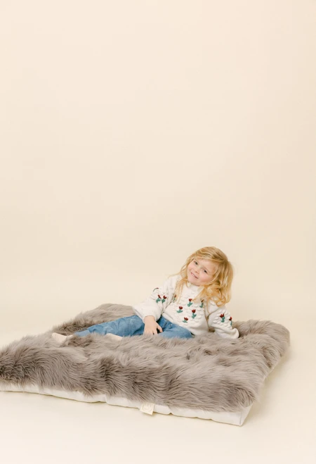 A long fur luxury fur fabric in a rich grey color.