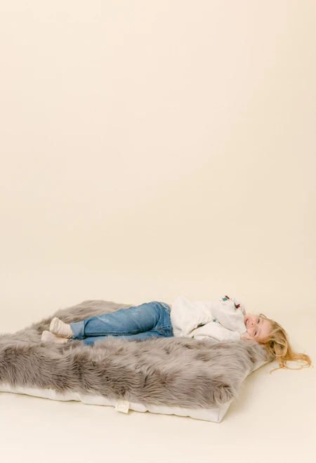 A long fur luxury fur fabric in a rich grey color.