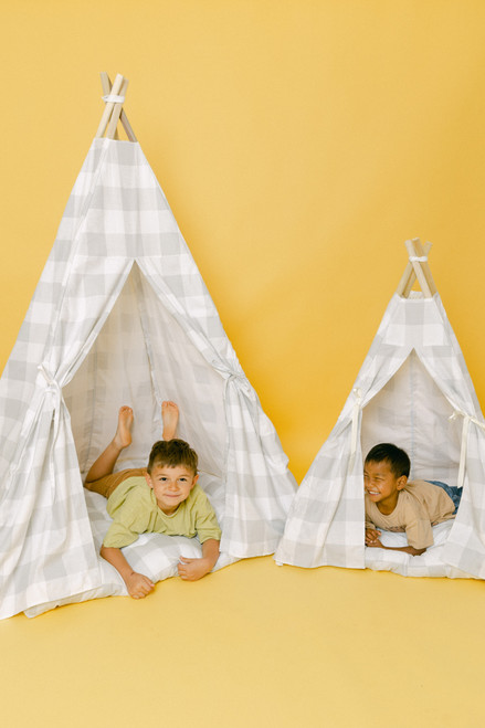 The Rowan Play Tent is a grey gingham/buffalo plaid play tent. This play tent is made from 7 oz. cotton (OEKO-TEX certified) fabric. The play tent comes with tie back doors. It has four wooden poplar rods that hold up a beautifully crafted play tent.