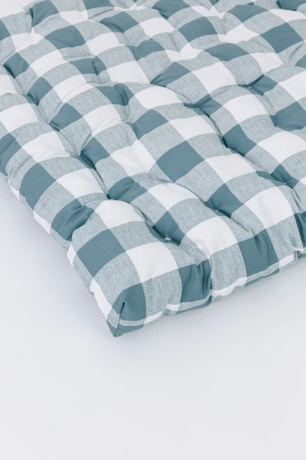 A gingham/buffalo check in color gunmetal using 100% twill cotton and stuffed with 100% premium hypoallergenic fiberfil.