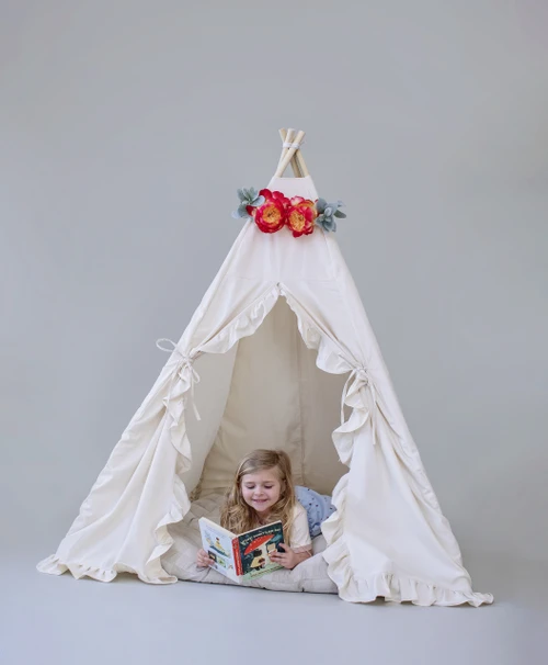 The Joanna tent is made from natural twill cotton with vertical ruffles on the front doors.