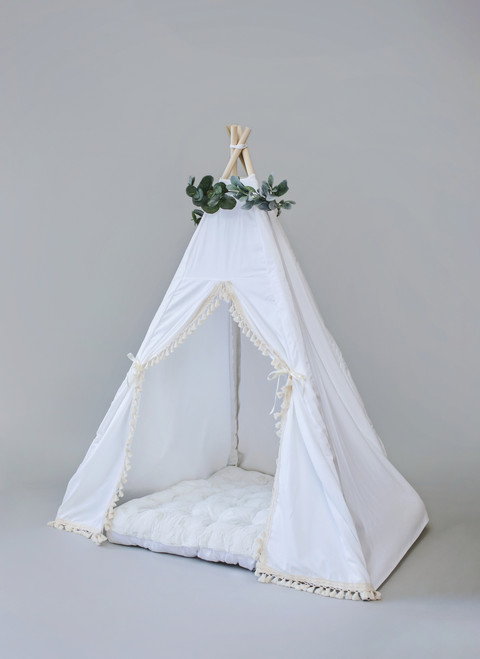 The Elliott tent is classy using white twill cotton with cream tassel fringe on the front panels.