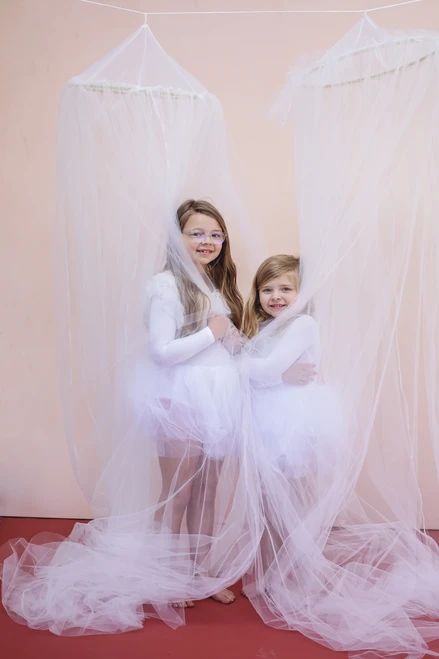 The Tulle canopy is handsewn using 15 yards of the finest crafted tulle available.