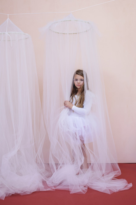 The Ruffle Tulle canopy is handsewn using 15 yards of the finest crafted tulle available. There's a ruffled tulle crown at the top of the canopy.