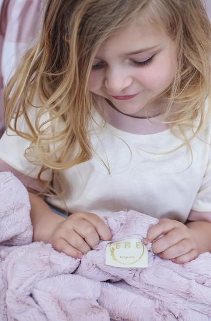 A soft, cozy, double-sided luxe cuddle hide fabric blanket.