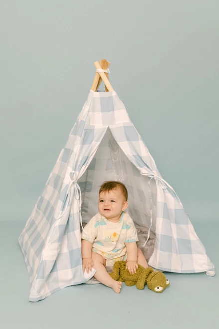 This tent is all blue gingham fabric pattern made of 100% 7 oz. cotton fabric. It has four wooden poplar rods that hold up a beautifully crafted tent.
