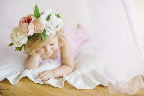 A circle mattress made of all white twill cotton fabric with a beautifully handcrafted ruffle around the edges.