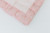 Pink candy stripe cotton fabric with pink lace around the edges.