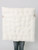 An ivory sherpa fabric that has a lambie textured, super-soft surface