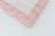 Pink candy stripe cotton fabric with pink lace around the edges.