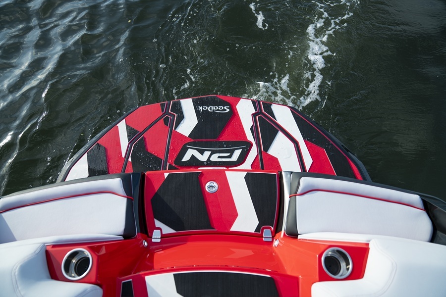 Nautique stern view with red and black hull and custom SeaDek flooring