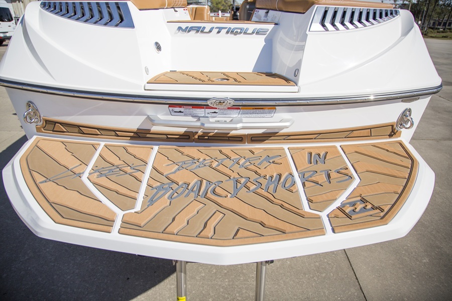 Nautique transom and swim platform featuring tan SeaDek with custom engraved design