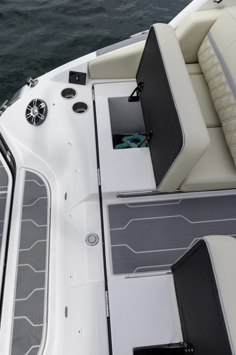 Regal cockpit lounge with gray SeaDek traction panels and storage hatches