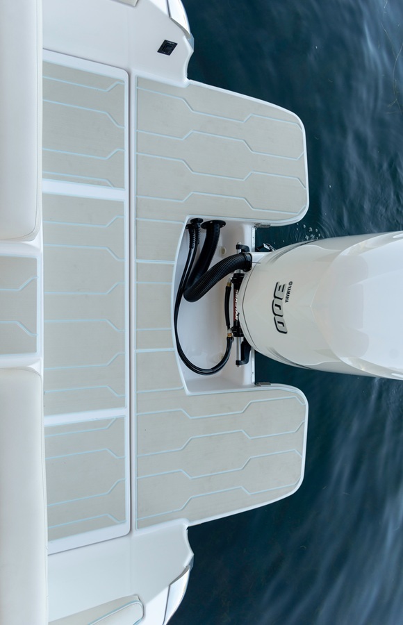 Regal swim platform and transom featuring light SeaDek panels around outboard