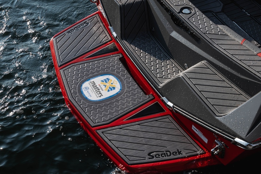 Nautique swim platform in red with custom gray SeaDek panels