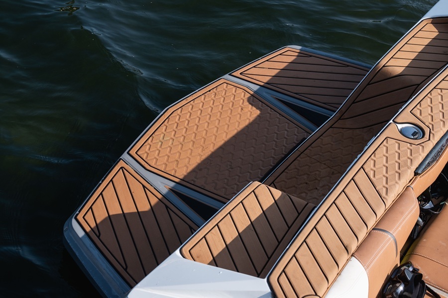 Nautique swim platform with tan SeaDek traction and black borders
