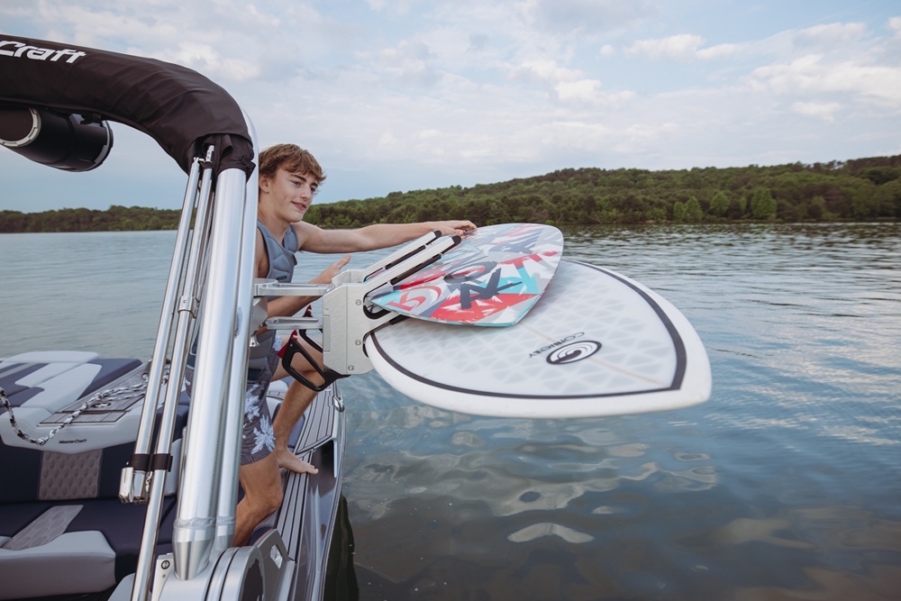 Man preparing to ride from MasterCraft boat equipped with custom SeaDek decking