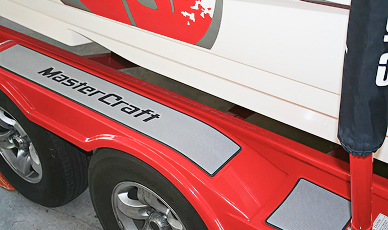 Boat trailer with SeaDek applied to the top of the wheel fender pads