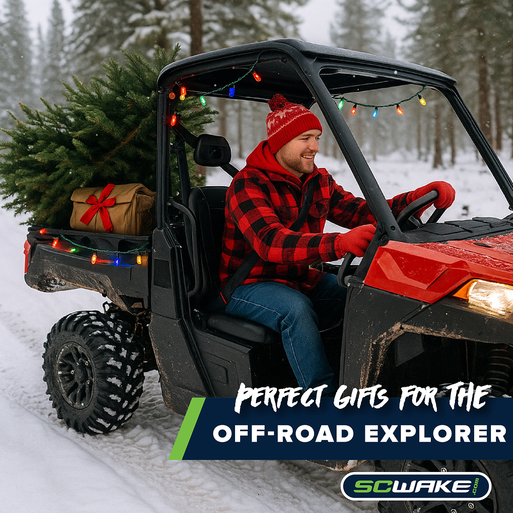 Man driving a side by side in the snow