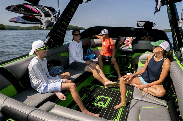 Family relaxing on a boat with SeaDek flooring