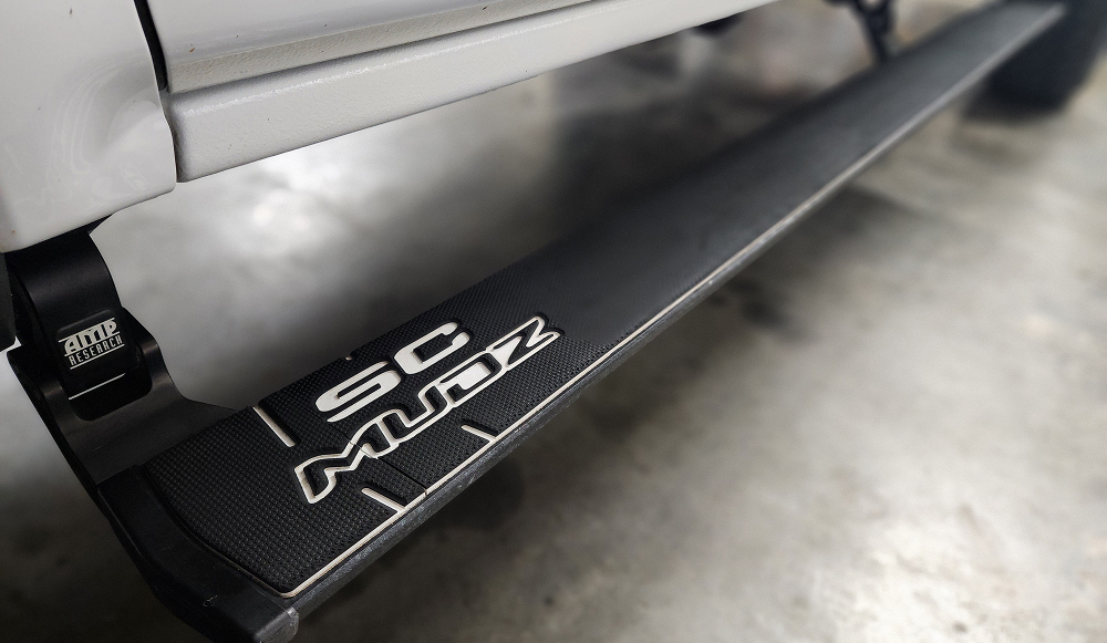 Truck step running board with SeaDek black over white colors and scmudz logo design