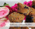 Cashew Butter Fudge from Desserts To Live For: chocolate squares topped with a cashew butter layer and a chocolate drizzle, on a white plate.