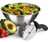 Stainless steel salad bowl filled with chopped green salad, with the rolling double-blade salad chopper with black handle in front, beside a halved avocado and radishes.