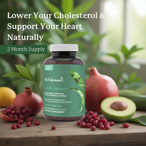 LDL Biotect bottle on a wooden table among pomegranates, pomegranate seeds, and a halved avocado, with the text: Lower your cholesterol and support your heart naturally. 2 month supply.