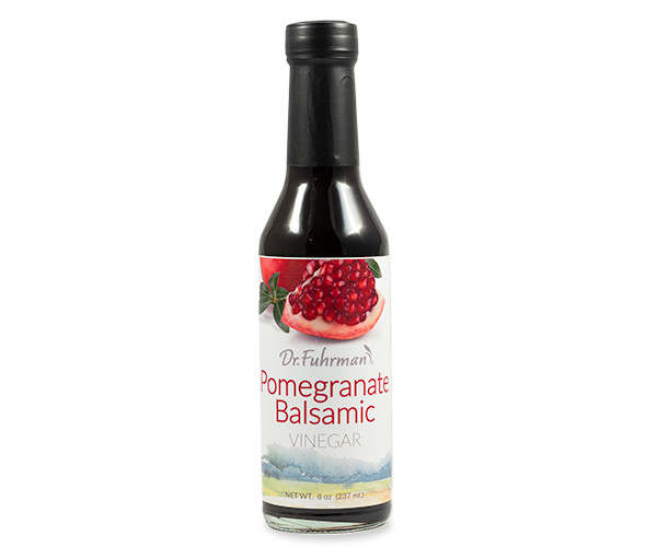 Dr. Fuhrman Pomegranate Balsamic Vinegar in an 8 fl oz (237 mL) glass bottle with a label showing a cut pomegranate.