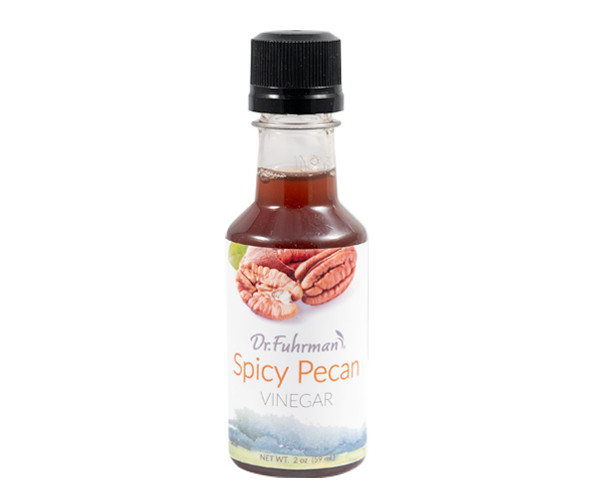 Dr. Fuhrman Spicy Pecan Vinegar in a 2 oz sampler-size bottle with a label showing pecan halves.
