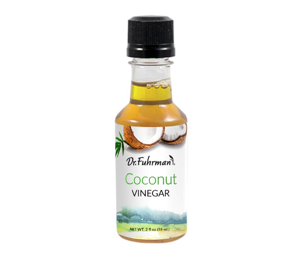 Dr. Fuhrman Coconut Vinegar in a 2 oz sampler-size bottle with a label showing a cracked coconut.