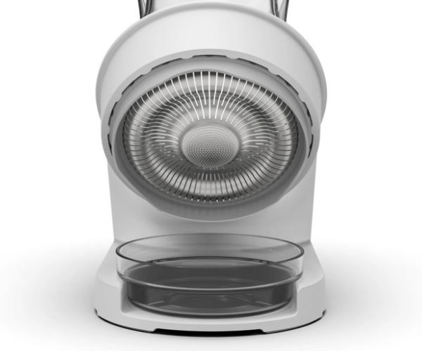 Close-up of the sprouter's strainer lid angled over its drip tray.