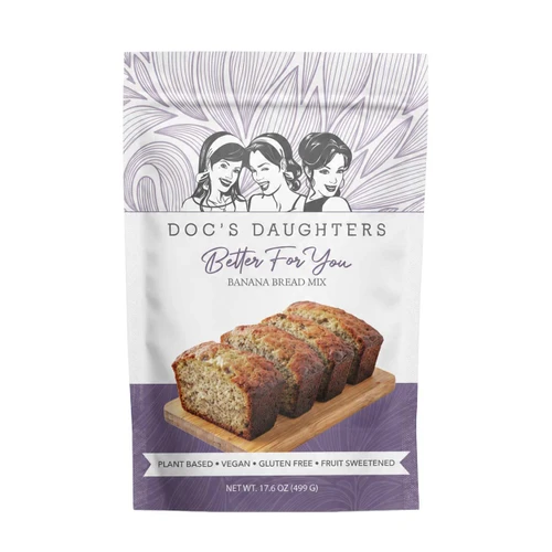 Doc's Daughters Better For You Banana Bread Mix pouch showing a sliced loaf on a wooden board; plant based, vegan, gluten free, fruit sweetened, net wt. 17.6 oz (499 g).