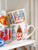 Custom: Cappuccinobeker 0,5l La Plage Sardientjes 