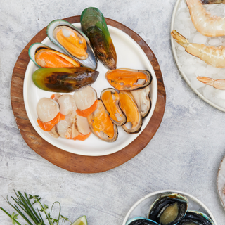 Sanford Greenshell™ Mussel Meat from Sanford & Sons with mussels and scallops on plate.