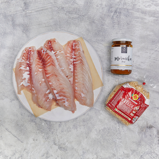 snapper fillets with pepper and me moroccan pasta and fregola pasta on grey background