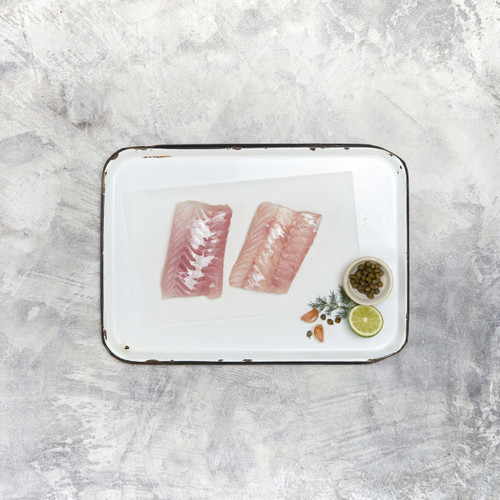 Sanford and Sons Ling Fish Fillets on tray with garnish and lime and pepper