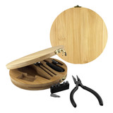 A bamboo toolkit in a circular case containing various tools including pliers and screwdriver bits, featuring a logo.