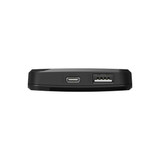 A black power bank with USB and USB-C ports, featuring a sleek and compact design.