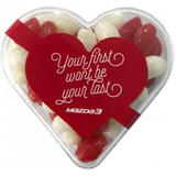 Acrylic heart container filled with red and white jelly beans, featuring a branded sticker.