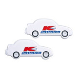 A car-shaped mint card featuring wheels, presented in white with a logo. Includes branding elements.