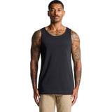 A man with tattoos wears a black singlet. The singlet features a logo and has a simple, classic design.