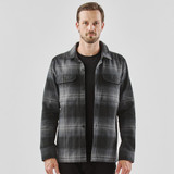A men's shacket in black and grey Highland plaid, featuring a button front and two chest pockets.
