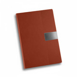 A brown A5 notebook featuring a textured design and a metallic accent, along with a branding logo.