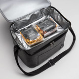 A grey insulated cooler bag with a zip, containing packages of pretzels and beer nuts inside.