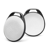 Two round Bluetooth trackers with a white circular surface and black edges, featuring a handle for easy attachment.