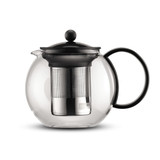 A glass tea press with a stainless steel infuser and a black lid and handle. Features a round design.
